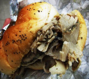 close_up_of_a_porchetta_sandwich